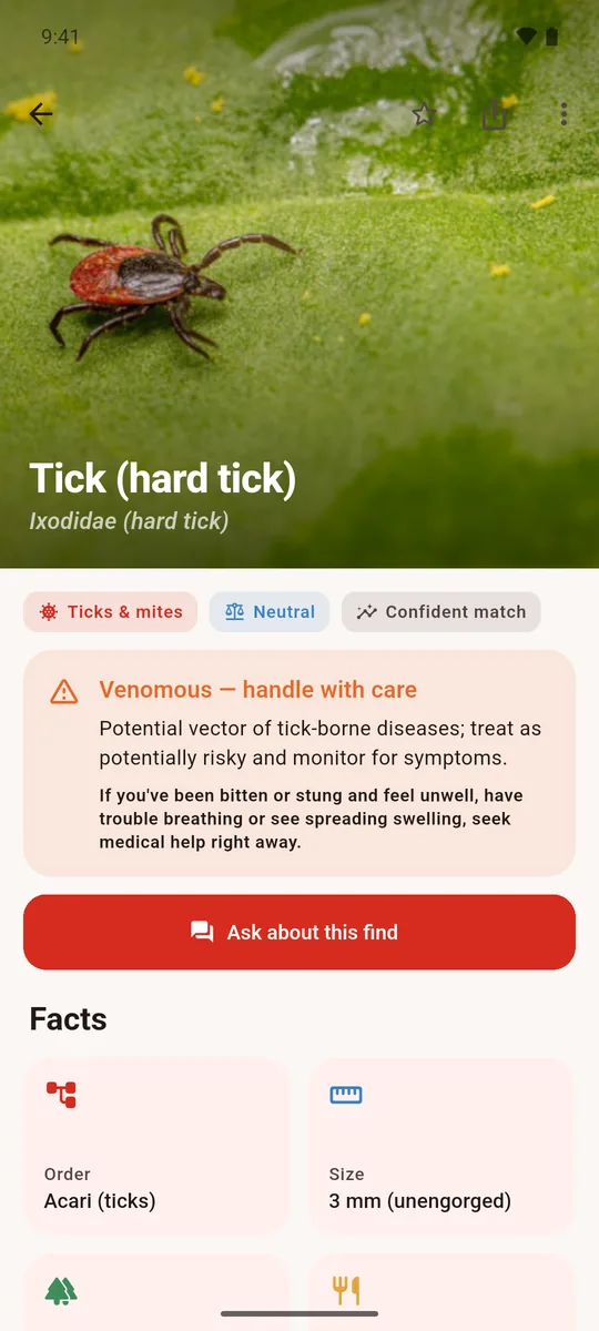 A tick identified as a hard tick with a venomous, handle-with-care safety card